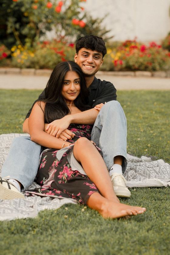 Couple sharing a blanket picnic in a meadow