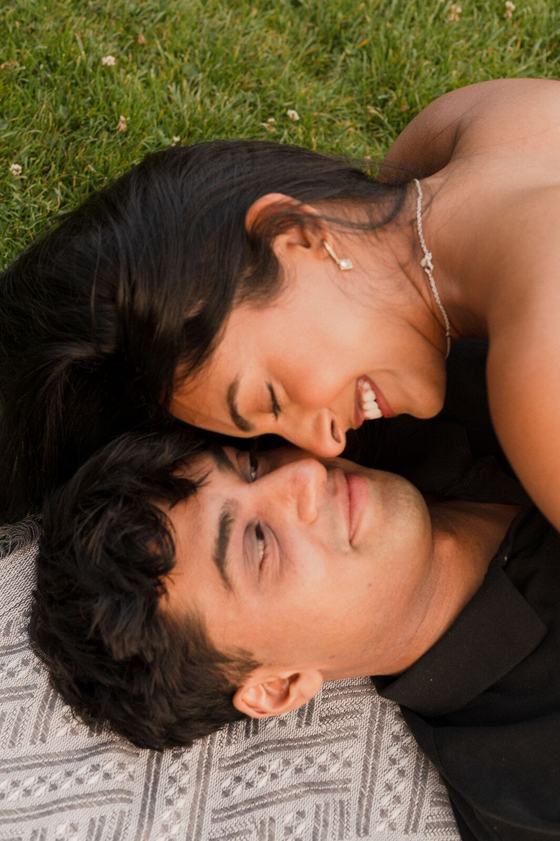Couple lying close, foreheads touching