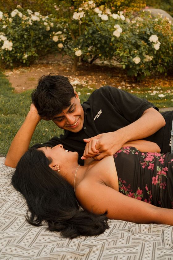 Couple lying together in tall grass