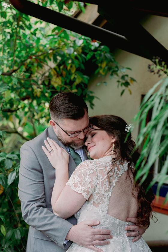 Couple embracing on a garden path