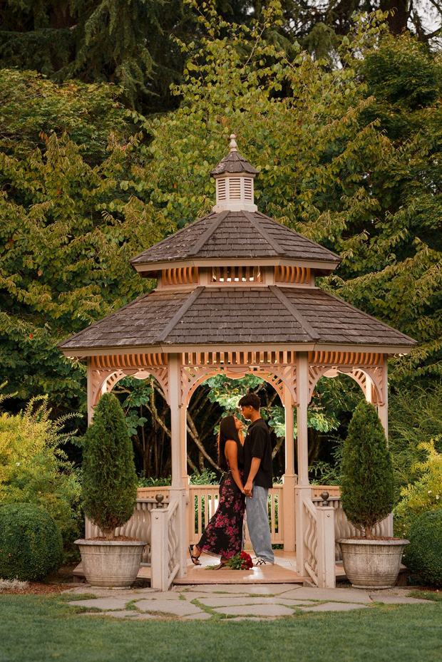 White gazebo in a landscaped private garden