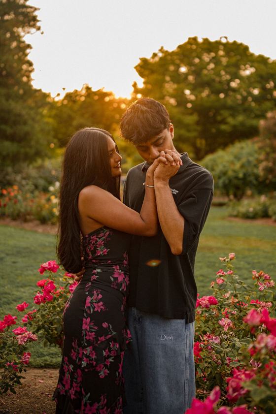 Couple standing close in low golden light