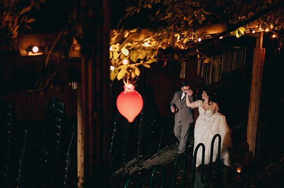 Paper lantern carried through rain at night