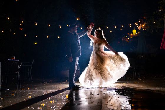 Couple under blurred city lights in the rain