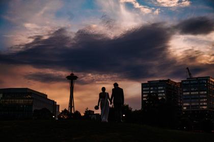 Couple silhouetted against the Seattle skyline