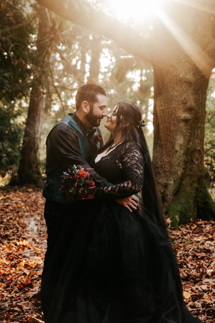 Couple kissing in a sunlit forest