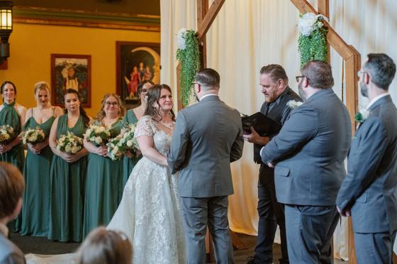 Wedding party gathered around an outdoor ceremony