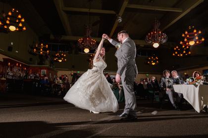 First dance twirl under warm string lights