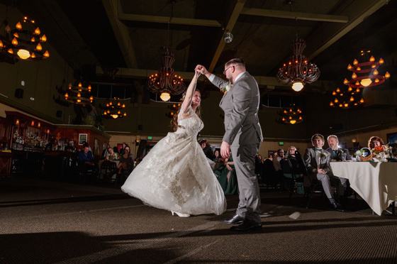 First dance twirl beneath string lights